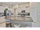 Kitchen with granite counters, stainless steel appliances, and island seating at 9423 Lemon Drop Loop, Sun City Center, FL 33573