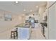 Bright kitchen with granite island, stainless appliances, and white cabinets at 9423 Lemon Drop Loop, Sun City Center, FL 33573