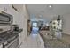 Well-appointed kitchen with modern appliances and a view into the living area at 9423 Lemon Drop Loop, Sun City Center, FL 33573