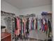 Spacious walk-in closet with shelving and hanging space, perfect for organization at 9423 Lemon Drop Loop, Sun City Center, FL 33573