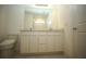 Modern bathroom with double vanity, marble countertop, and a toilet at 9512 Summers Cay Cir, Thonotosassa, FL 33592