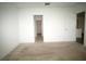 Spacious bedroom boasts neutral carpet, white walls, and an open doorway to a closet at 9512 Summers Cay Cir, Thonotosassa, FL 33592