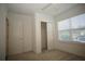 Cozy bedroom with a ceiling fan, carpet, and a window providing natural light at 9512 Summers Cay Cir, Thonotosassa, FL 33592