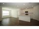 Bright, modern kitchen with stainless appliances, island, and eat-in space at 9512 Summers Cay Cir, Thonotosassa, FL 33592