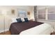 Bedroom with a comfy bed, framed art and a window bringing in natural light at 9700 Starkey Rd # 325, Seminole, FL 33777