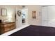 Bedroom featuring a dark bed, side table, and view into another room at 9700 Starkey Rd # 325, Seminole, FL 33777