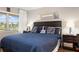 Comfortable bedroom with a large window providing natural light and a view of the outdoors at 9700 Starkey Rd # 325, Seminole, FL 33777