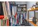 Walk-in closet featuring custom shelving, hanging rods, and ample storage space at 9700 Starkey Rd # 325, Seminole, FL 33777