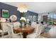 Bright dining room area with stylish chandelier, connecting to the living space at 9700 Starkey Rd # 325, Seminole, FL 33777