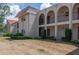 Charming multi-story condo building with balconies and landscaped grounds at 9700 Starkey Rd # 325, Seminole, FL 33777