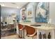 Open concept kitchen bar that offers extra seating at 9700 Starkey Rd # 325, Seminole, FL 33777