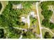 Aerial view of property lines showing home, garage, and landscaping on .86 acre lot at 1025 Reading Rd, Lutz, FL 33558