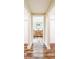 Bathroom with wood-look floors, a double sink vanity, and white cabinets at 1025 Reading Rd, Lutz, FL 33558