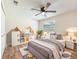 Bedroom with a modern ceiling fan, and toys at 1025 Reading Rd, Lutz, FL 33558