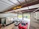 Large open garage with metal interior and multiple vehicles stored inside at 1025 Reading Rd, Lutz, FL 33558