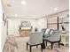 Inviting living room featuring a comfortable sofa, elegant chairs, neutral tones, and ample space for relaxation at 1025 Reading Rd, Lutz, FL 33558