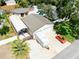 An aerial view reveals the property's expansive lot, two-car garage, car port and a pool in the back yard at 11988 117Th St, Seminole, FL 33778
