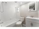 Bathroom featuring a shower and tub combination with a white vanity and a window for natural light at 11988 117Th St, Seminole, FL 33778