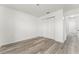 Bedroom featuring wood-look flooring and a double door closet at 11988 117Th St, Seminole, FL 33778