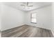 Bedroom with wood-look floors and a window bringing in natural light at 11988 117Th St, Seminole, FL 33778