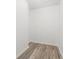 Walk-in closet showcasing wood-look flooring and ample storage space at 11988 117Th St, Seminole, FL 33778