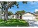 Charming single-story home with lush green lawn and inviting curb appeal at 11988 117Th St, Seminole, FL 33778