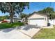 Single-story home featuring a two-car garage and an oversized detached garage at 11988 117Th St, Seminole, FL 33778