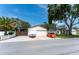Property view with an oversized two car garage and carport at 11988 117Th St, Seminole, FL 33778
