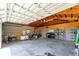 The expansive garage has an abundance of storage and an open rafter ceiling at 11988 117Th St, Seminole, FL 33778