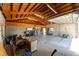 An expansive garage is ready for use as a workshop or storage with exposed rafter ceilings at 11988 117Th St, Seminole, FL 33778