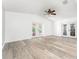 A bright living area with durable modern floors features dual patio doors leading to the lanai at 11988 117Th St, Seminole, FL 33778