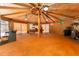 Inside the spacious pool house, offering wood flooring, bamboo walls, a bar, pool table, and exercise equipment at 11988 117Th St, Seminole, FL 33778