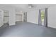 Large bedroom boasts light-filled windows, closet, and ensuite bathroom with shower at 1203 E New Orleans Ave, Tampa, FL 33603