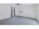 Bedroom featuring gray floors, neutral decor, and a large window at 1203 E New Orleans Ave, Tampa, FL 33603