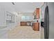 Spacious kitchen with tile flooring, granite countertops, and stainless-steel appliances at 1203 E New Orleans Ave, Tampa, FL 33603