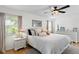 Comfortable bedroom with a ceiling fan and soothing color scheme at 125 Live Oak Ln, Largo, FL 33770