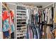 Walk-in closet with custom shelving and organization systems for clothes, shoes, and accessories at 125 Live Oak Ln, Largo, FL 33770
