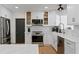 Bright, updated kitchen with shaker cabinets, stainless appliances, and white subway tile backsplash at 125 Live Oak Ln, Largo, FL 33770
