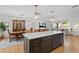 Spacious kitchen and dining area with large island, bar seating, and ample cabinet space at 125 Live Oak Ln, Largo, FL 33770
