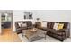 Inviting living room features leather furniture and a cozy atmosphere at 125 Live Oak Ln, Largo, FL 33770