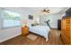 Bright bedroom includes a ceiling fan and large window at 12873 Cumberland Dr, Largo, FL 33773