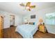 Cozy bedroom with an ensuite bathroom and plenty of natural light at 12873 Cumberland Dr, Largo, FL 33773