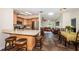 Bright kitchen features a breakfast bar, stainless steel appliances, and an open view of the dining and living areas at 12873 Cumberland Dr, Largo, FL 33773