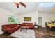 Bright living room features a skylight, ceiling fan, expansive window and a casual dining area at 12873 Cumberland Dr, Largo, FL 33773