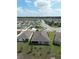 Expansive aerial view showcasing the home's backyard, neighborhood streetscape, and surrounding community at 13111 Pepper Stem St, Spring Hill, FL 34609