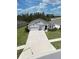 An aerial shot showcasing the home's front yard and surrounding landscape at 13111 Pepper Stem St, Spring Hill, FL 34609