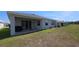 The home's backyard with a covered patio perfect for entertaining and enjoying the outdoors at 13111 Pepper Stem St, Spring Hill, FL 34609