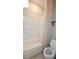 Neat bathroom with a shower-tub, a toilet and simple design at 13111 Pepper Stem St, Spring Hill, FL 34609