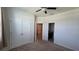 Spacious bedroom with large closets, an ensuite bathroom, and neutral carpeting at 13111 Pepper Stem St, Spring Hill, FL 34609