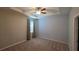 Carpeted bedroom with modern curtains, tray ceiling with fan and a light color palette for a calm, welcoming feel at 13111 Pepper Stem St, Spring Hill, FL 34609